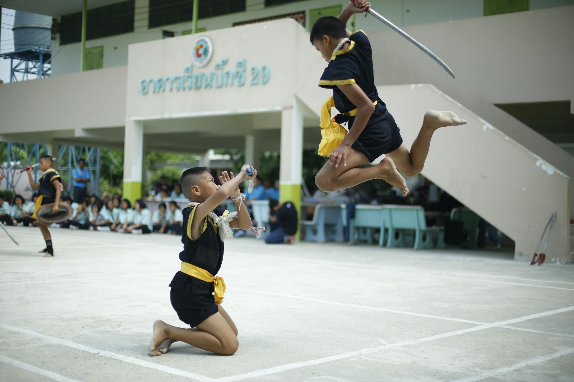 photo of boys fighting with swords