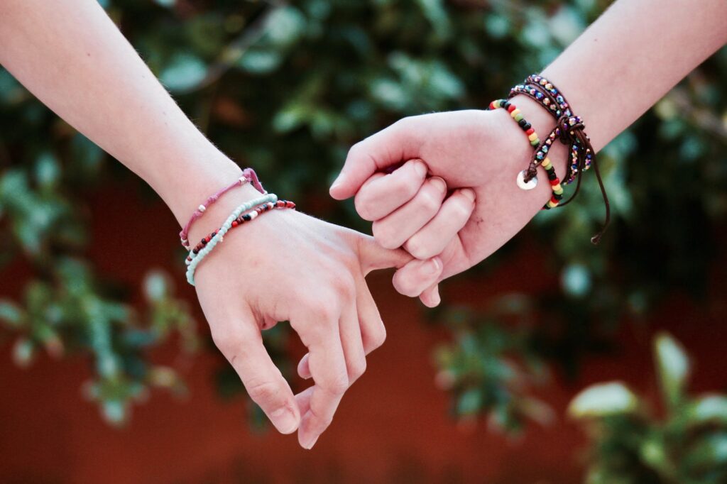 two person holding hands