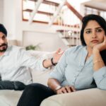 young indian couple having quarrel at home