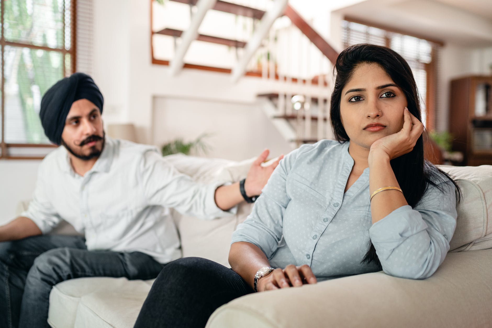 young indian couple having quarrel at home