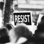 monochrome photo of resist signage