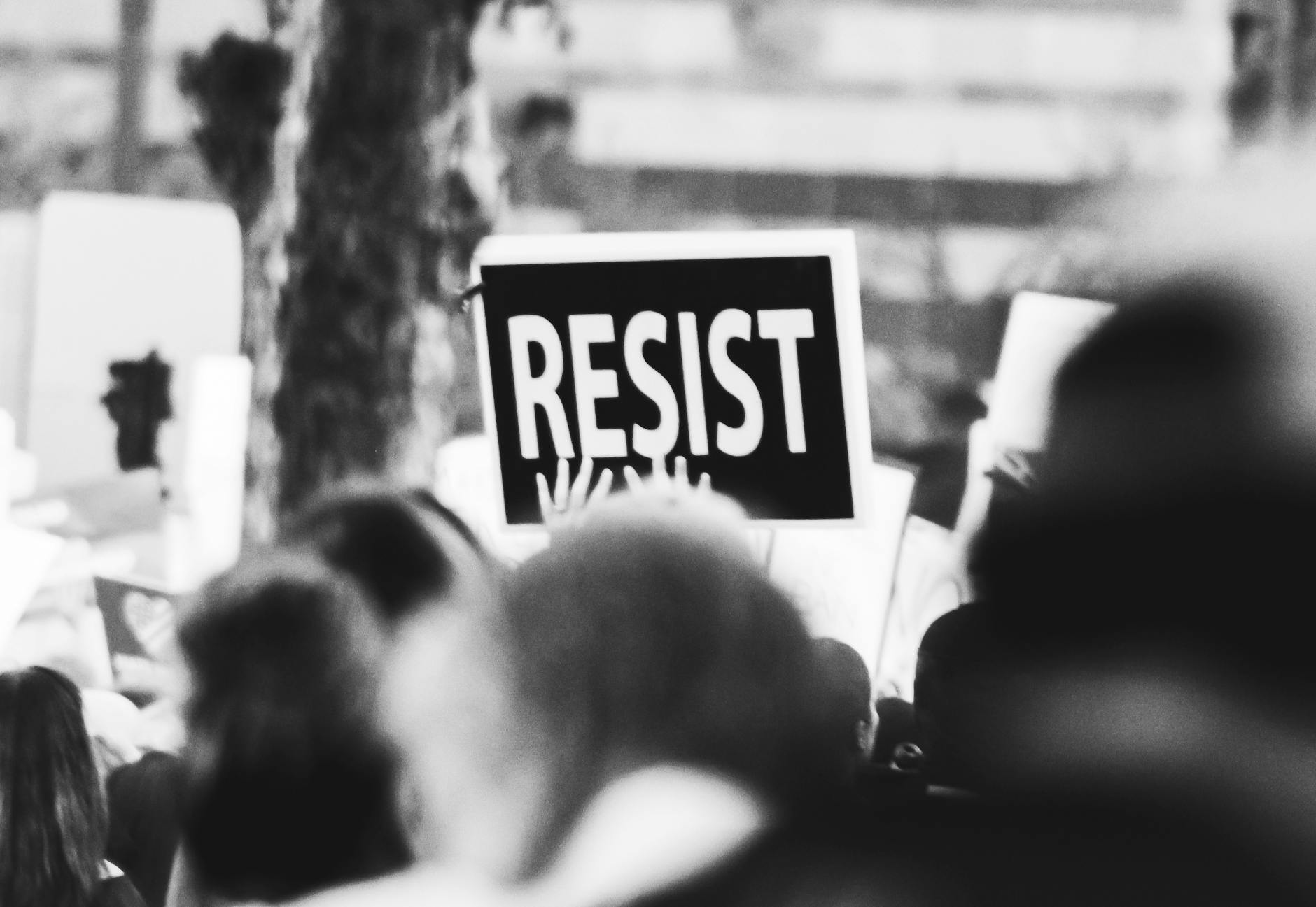 monochrome photo of resist signage