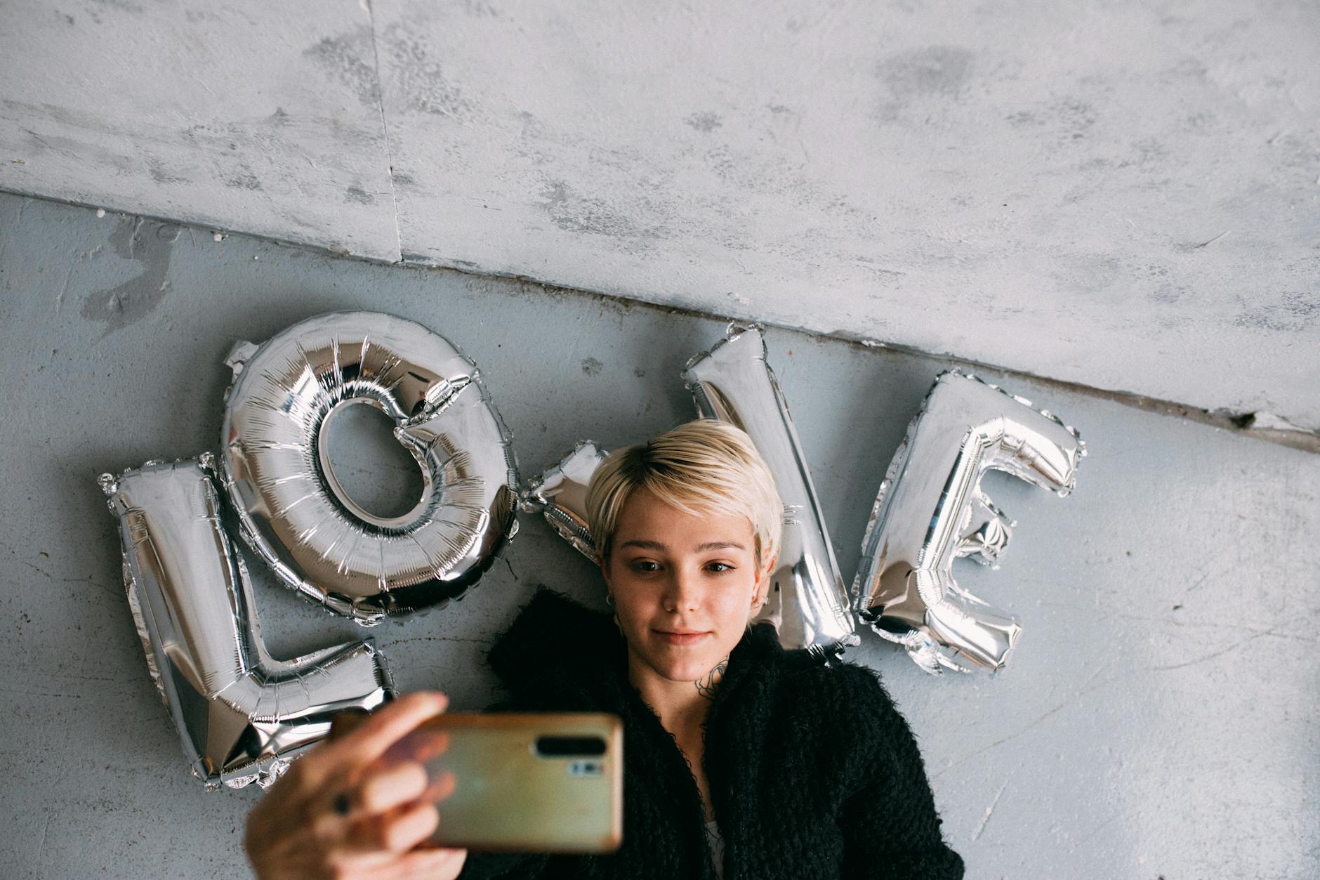 a woman doing selfie using a smartphone